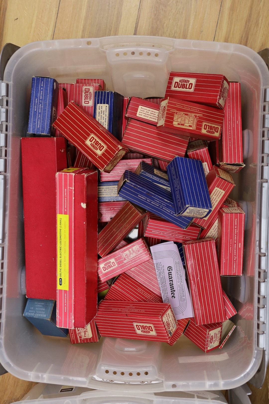 A large quantity of Hornby Dublo carriages, wagons and other rolling stock, much with original boxes, much unboxed, spare boxes which may well match, 5 boxes